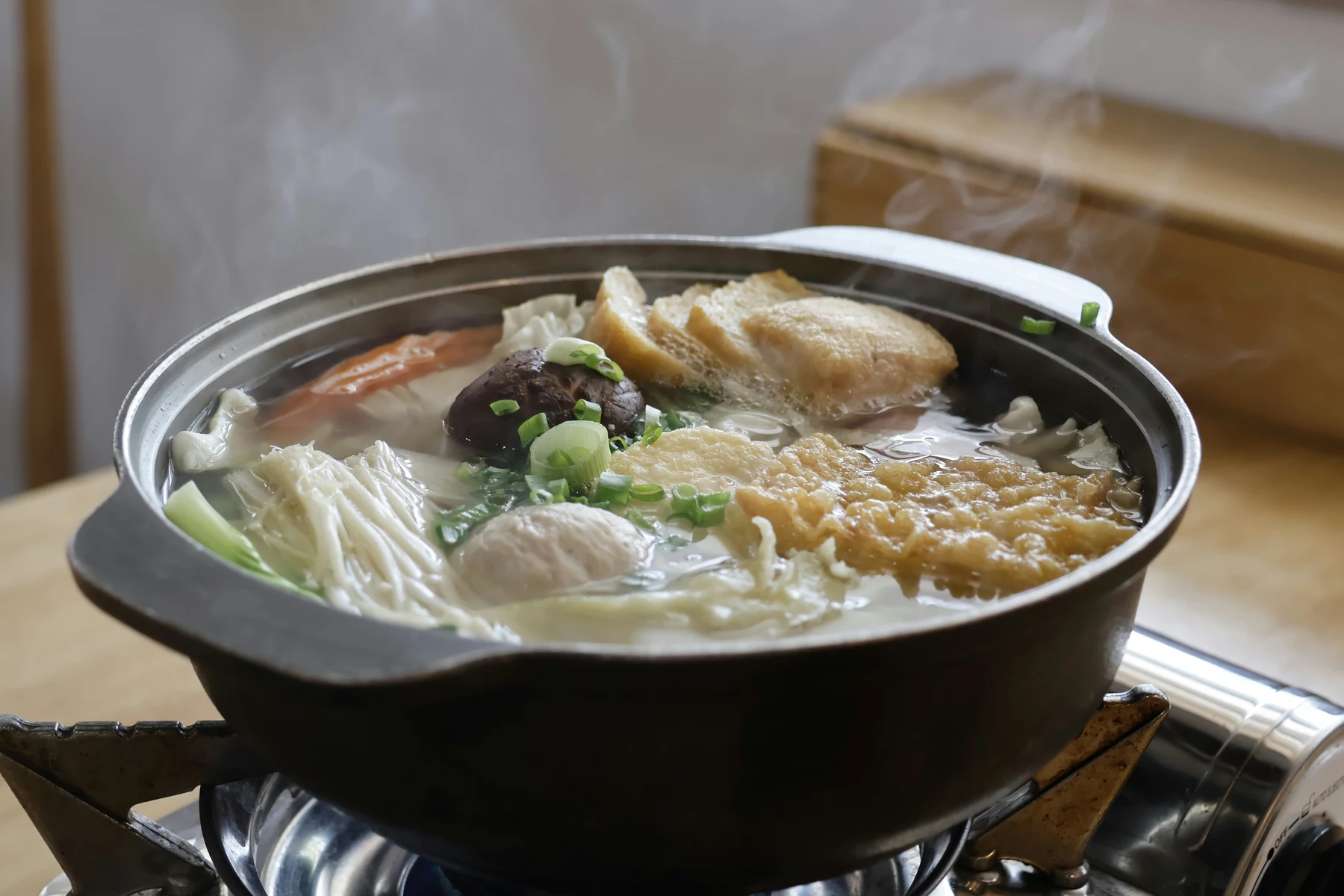 A pot of soup on top of a stove — Taiwanese hotpot